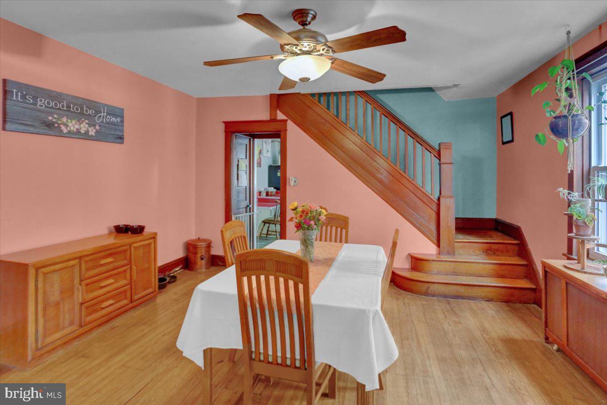 136 West Elm Street Reading, PA 19607 - Photo 6 of 23 a view of a dining room with furniture a chandelier and wooden floor