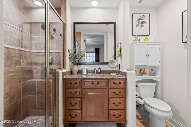a bedroom with a bed couch and window
