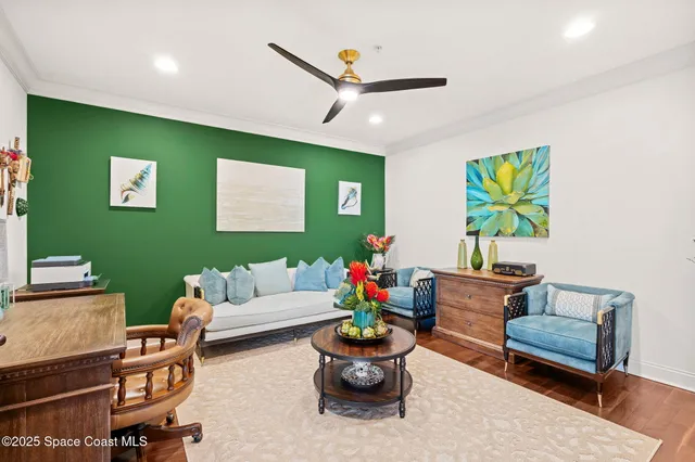 a living room with furniture and wooden floor