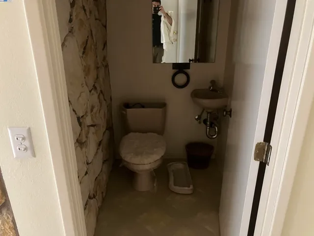 a view of a bathroom with a sink and mirror