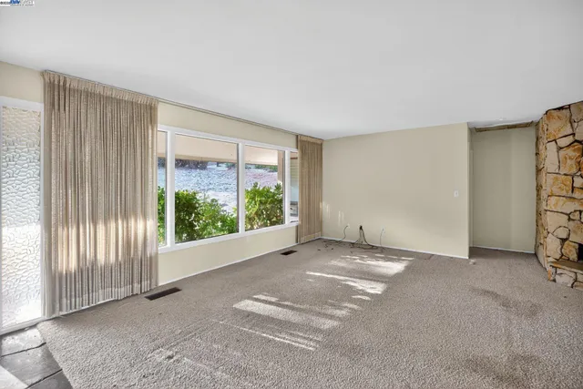 an empty room with windows