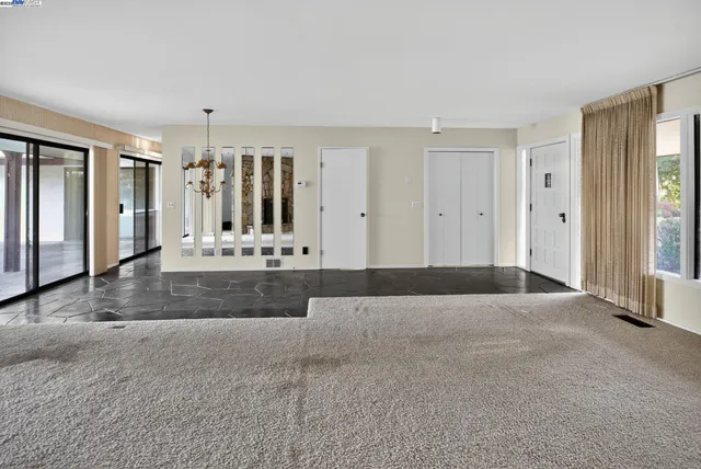 a view of a room with a lot of large windows