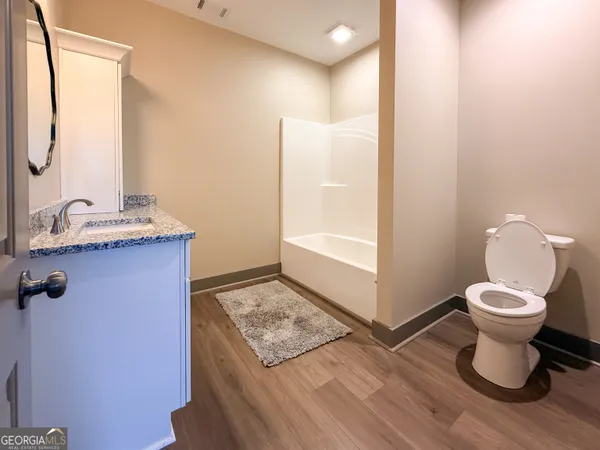 a bathroom with a sink and a toilet