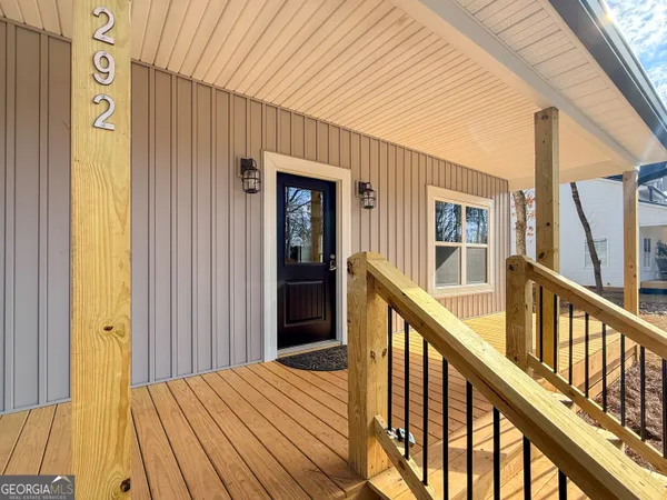 a view of balcony with wooden floor
