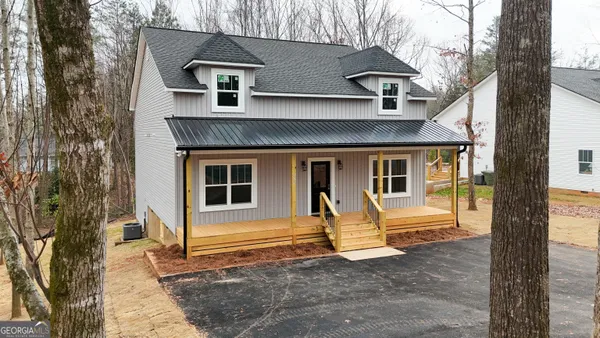 a front view of a house with parking