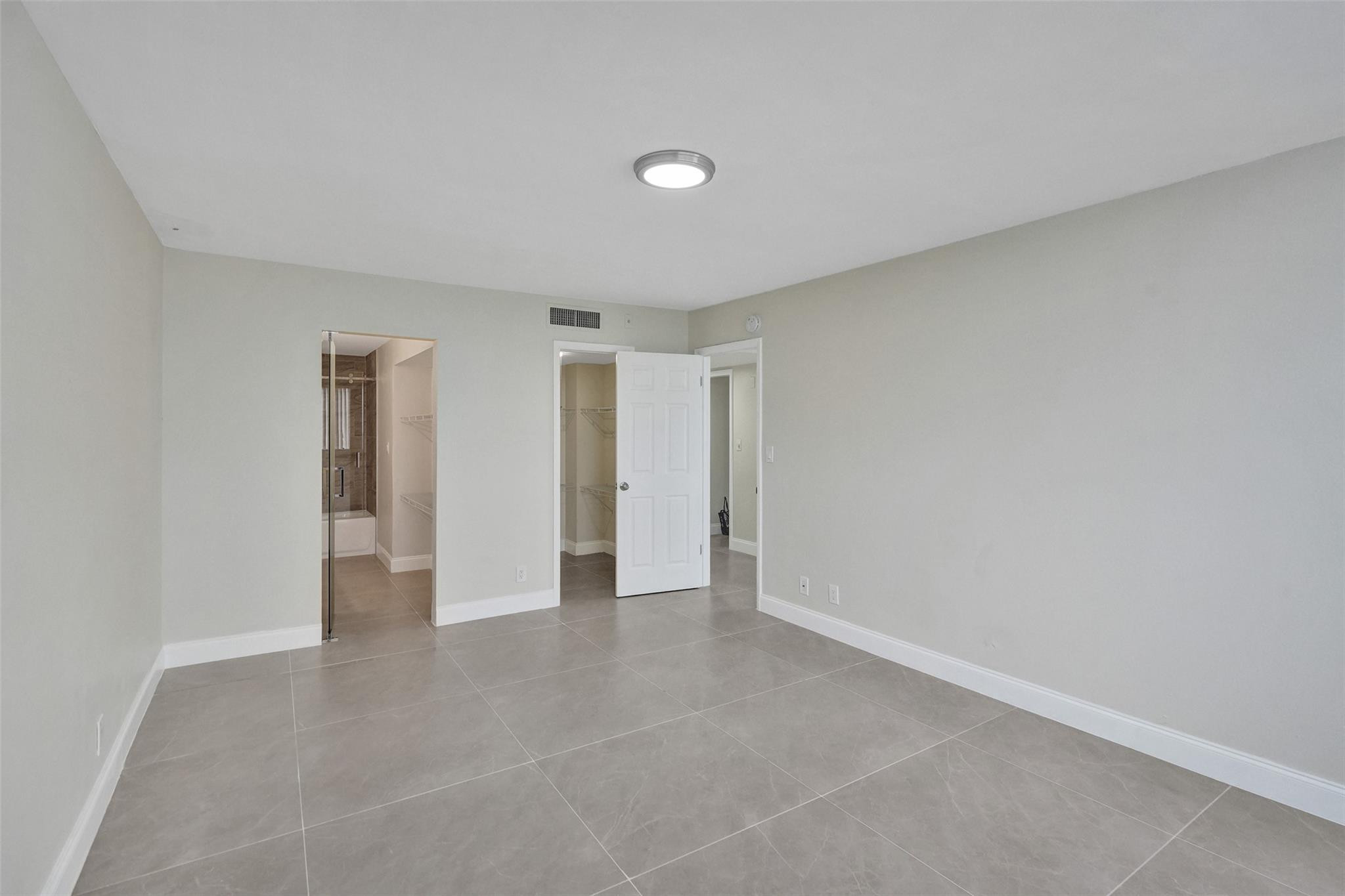 4222 Inverrary Boulevard, Unit 4810 Lauderhill, FL 33319 - Photo 33 of 63 a view of an empty room with closet and a window