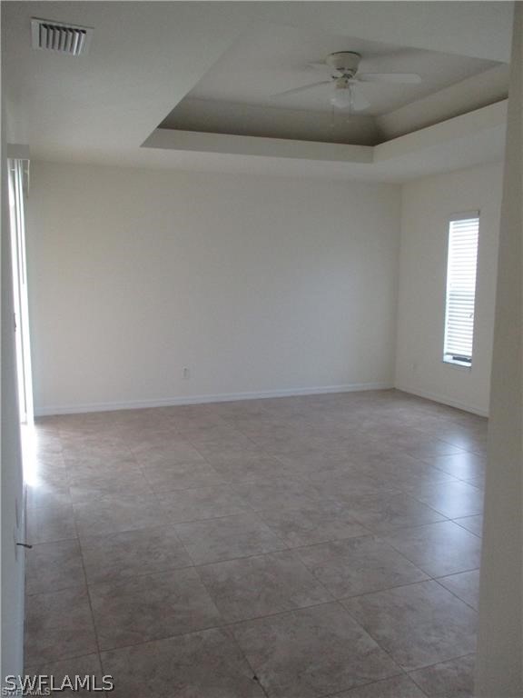 520 Raintree Street East Lehigh Acres, FL 33974 - Photo 14 of 18 a view of room and hall with a fan