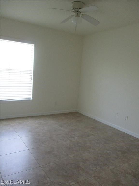 520 Raintree Street East Lehigh Acres, FL 33974 - Photo 15 of 18 an empty room with a window