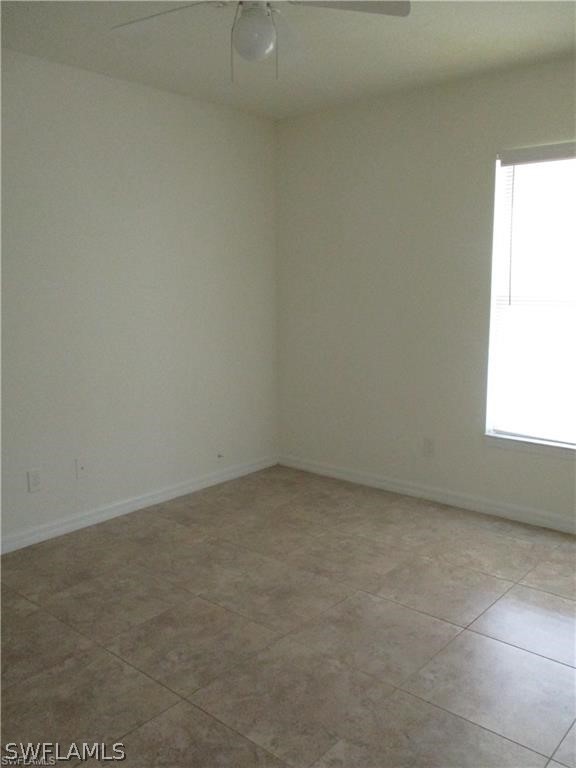 520 Raintree Street East Lehigh Acres, FL 33974 - Photo 16 of 18 a view of an empty room and a window