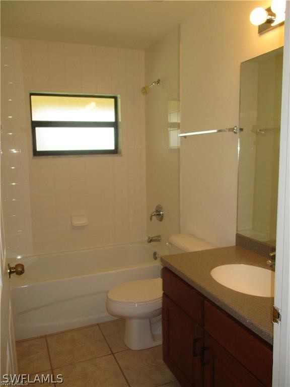 520 Raintree Street East Lehigh Acres, FL 33974 - Photo 18 of 18 a bathroom with a granite countertop sink toilet and shower