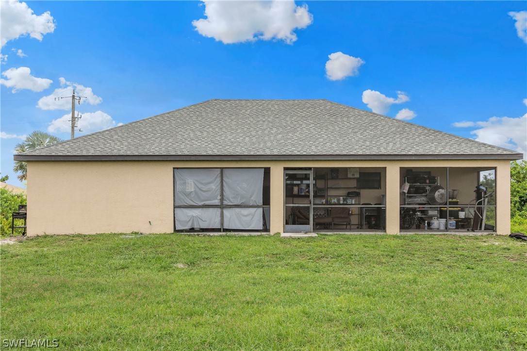520 Raintree Street East Lehigh Acres, FL 33974 - Photo 5 of 18 a house view with a garden space