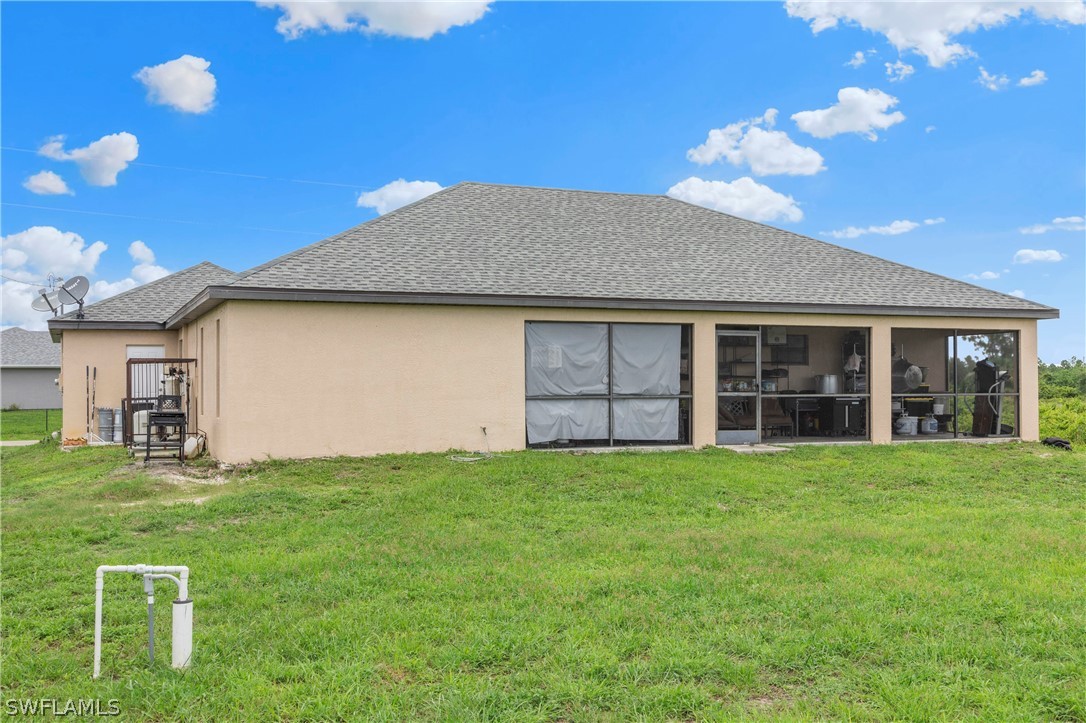 520 Raintree Street East Lehigh Acres, FL 33974 - Photo 8 of 18 a house view with a garden space
