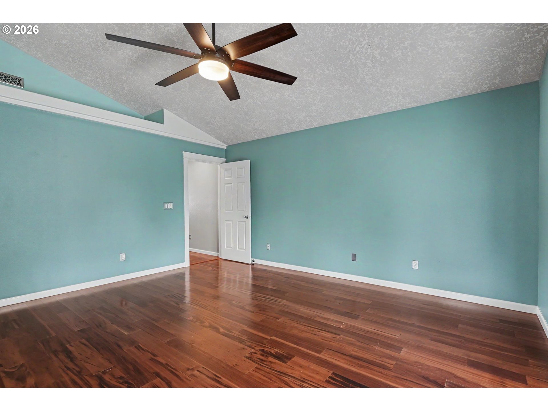 1462 Barnick Road Northeast Keizer, OR 97303 - Photo 27 of 48 an empty room with wooden floor and fan