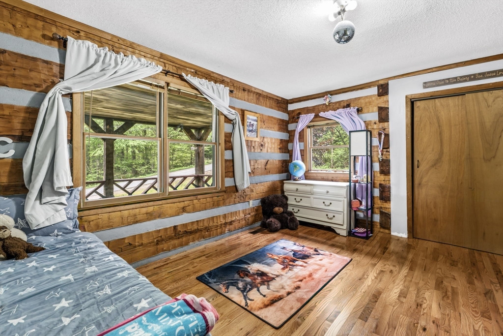 22 Lyon Hill Road Chester, MA 01011 - Photo 24 of 38 a bed room with a bed and a window