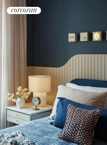 a living room with furniture a flat screen tv and a large window