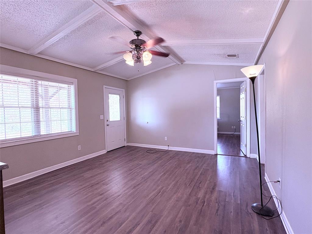 768 Highway 507 Castor, LA 71016 - Photo 12 of 22 a view of an empty room with wooden floor and a window