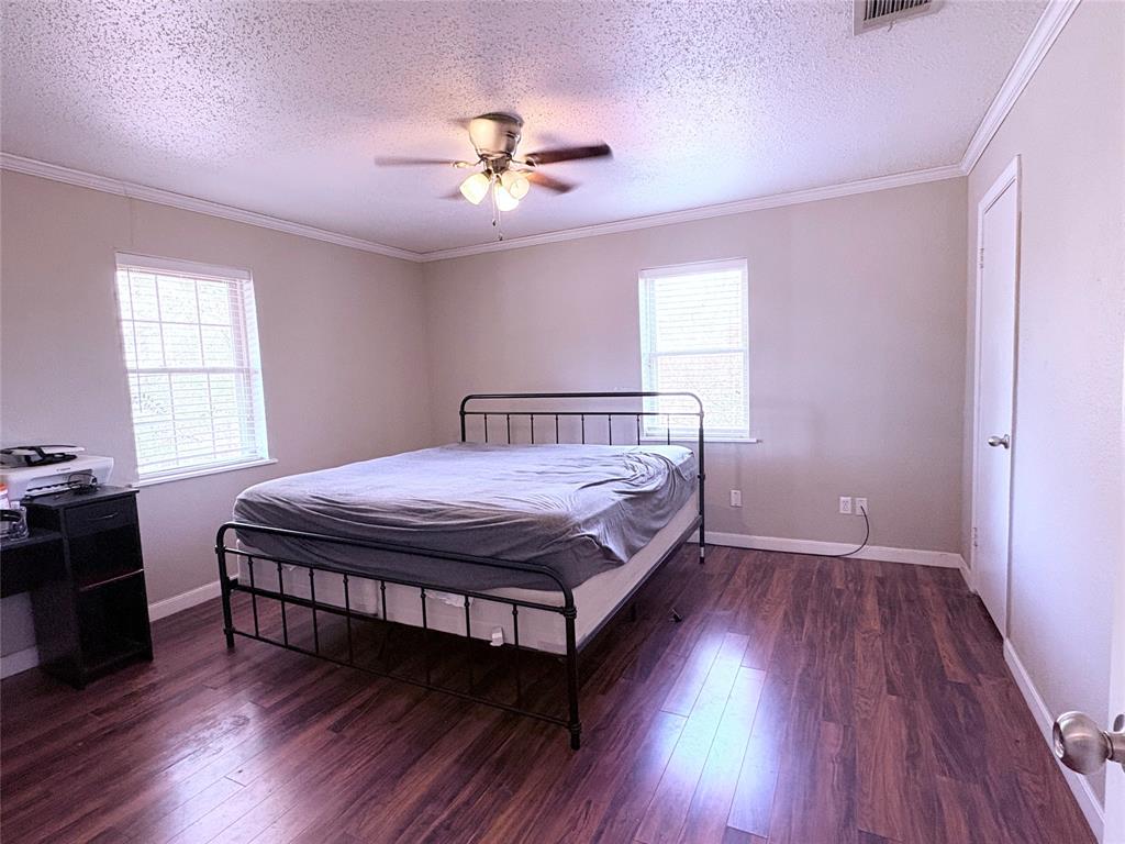 768 Highway 507 Castor, LA 71016 - Photo 17 of 22 a bedroom with a bed and wooden floor