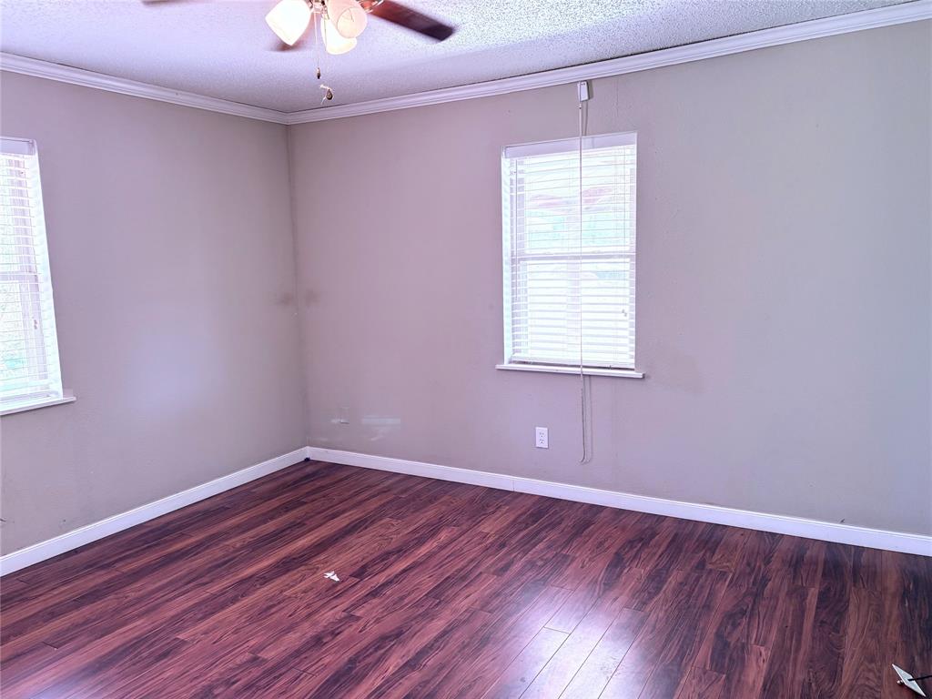 768 Highway 507 Castor, LA 71016 - Photo 22 of 22 an empty room with a window and wooden floor