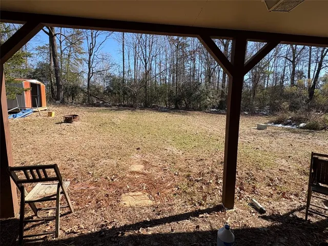 a view of a porch with a yard