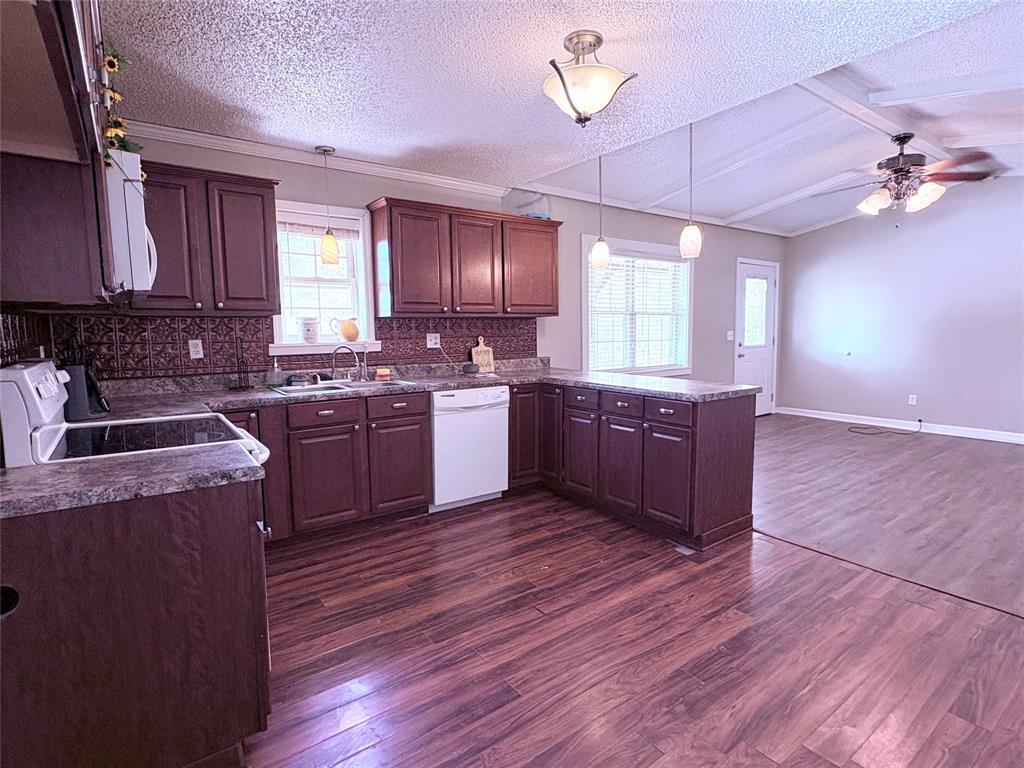 768 Highway 507 Castor, LA 71016 - Photo 9 of 22 a kitchen with wooden floors and a sink