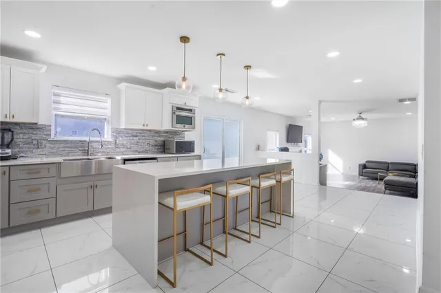 a kitchen with a sink cabinets and counter space
