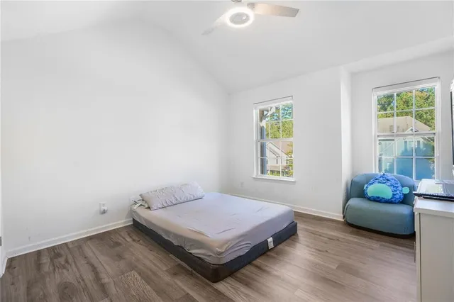 a bedroom with a bed and window