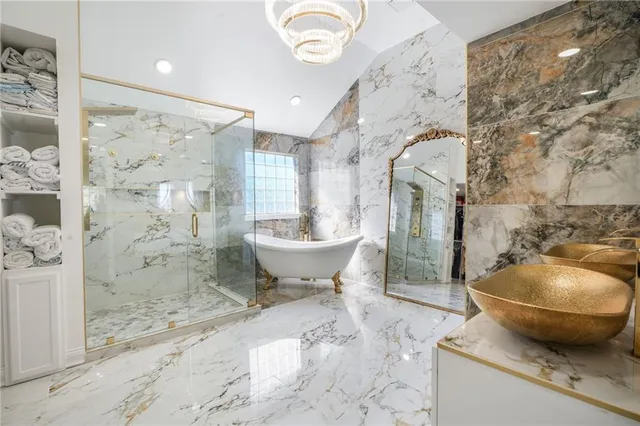 a spacious bathroom with a toilet sink and shower