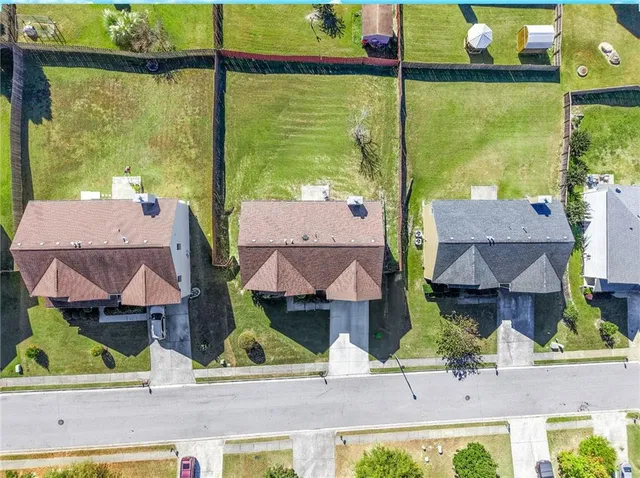 a view of houses with an outdoor space and seating area