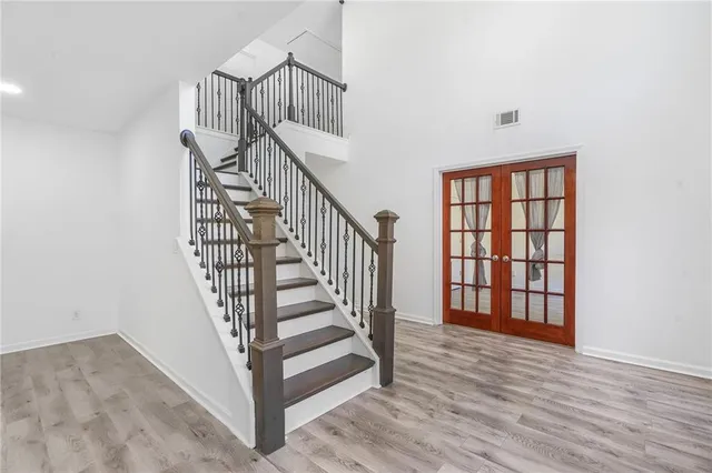 a view of staircase with white walls and a window