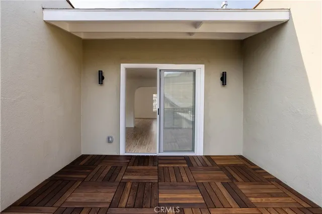 a view of a livingroom with wooden floor and door