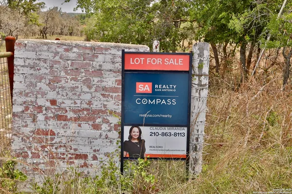 a sign on the brick wall