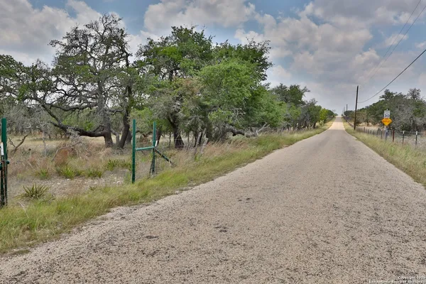 a view of a road with a yard