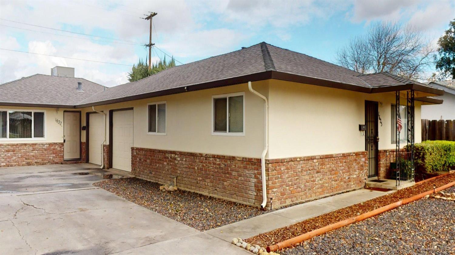 1625 West Rumble Road Modesto, CA 95350 - Photo 1 of 1 a front view of a house with a yard