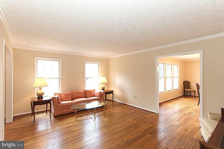 2213 Wakerobin Lane Reston, VA 20191 - Photo 5 of 28 a living room with furniture and a wooden floor