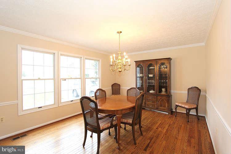 2213 Wakerobin Lane Reston, VA 20191 - Photo 8 of 28 a view of a dining room with furniture and window