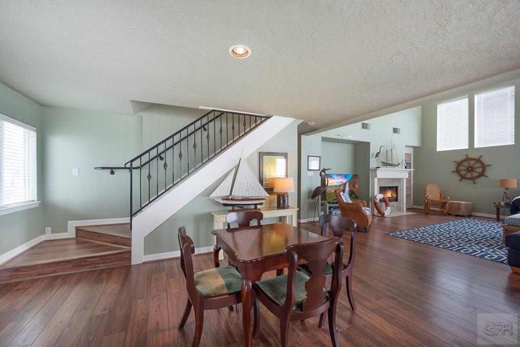 131 Isles End Road Tiki Island, TX 77554 - Photo 16 of 48 a view of a dining room with furniture wooden floor and chandelier