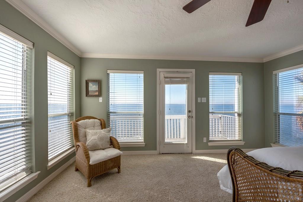 131 Isles End Road Tiki Island, TX 77554 - Photo 20 of 48 a living room with furniture and windows