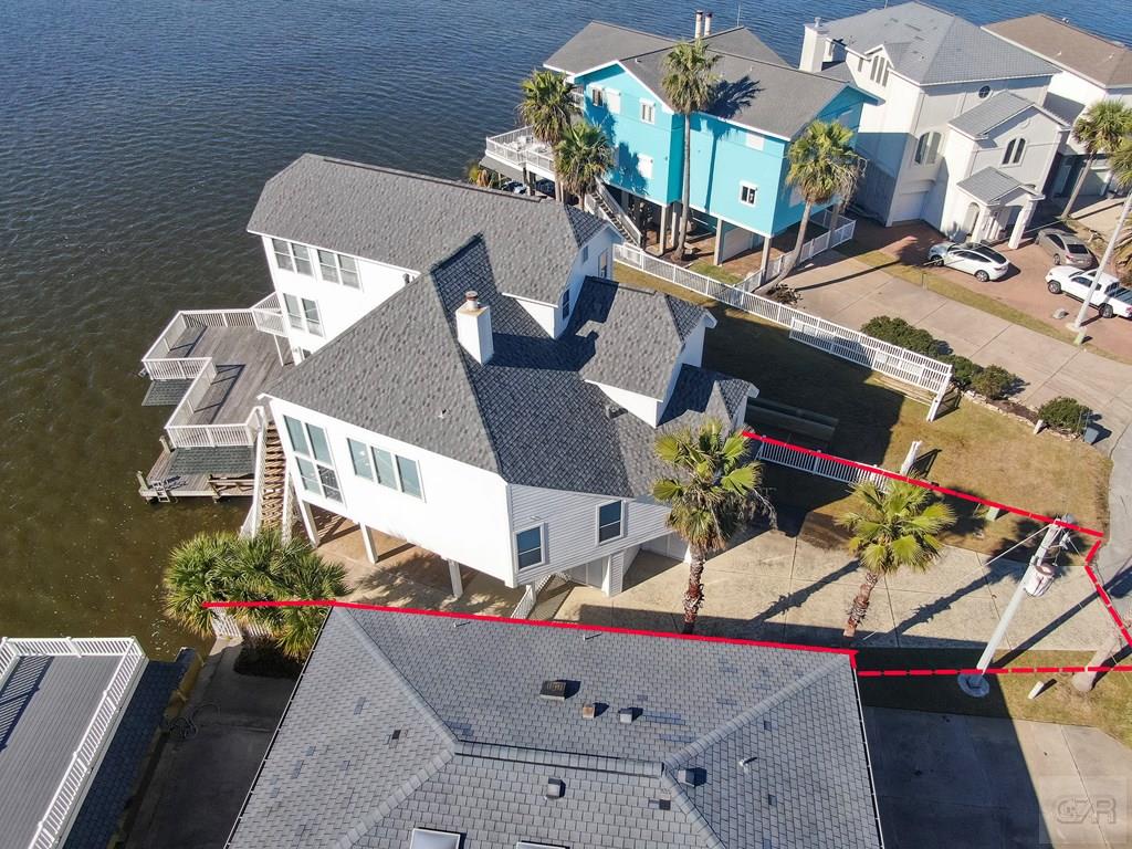 131 Isles End Road Tiki Island, TX 77554 - Photo 3 of 48 an aerial view of a house swimming pool and outdoor seating