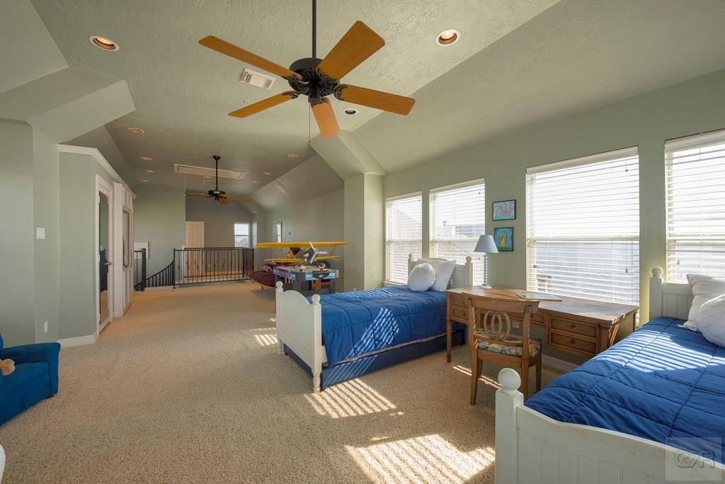 131 Isles End Road Tiki Island, TX 77554 - Photo 36 of 48 a living room with furniture and a large window