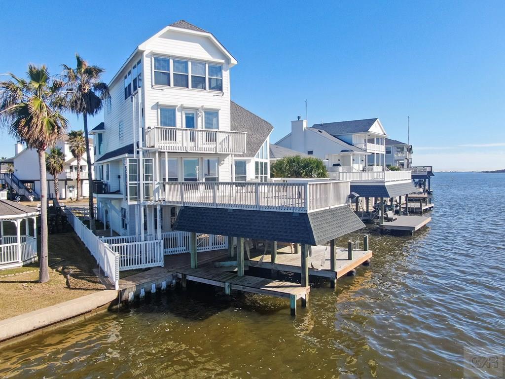 131 Isles End Road Tiki Island, TX 77554 - Photo 7 of 48 a view of pool with outdoor seating