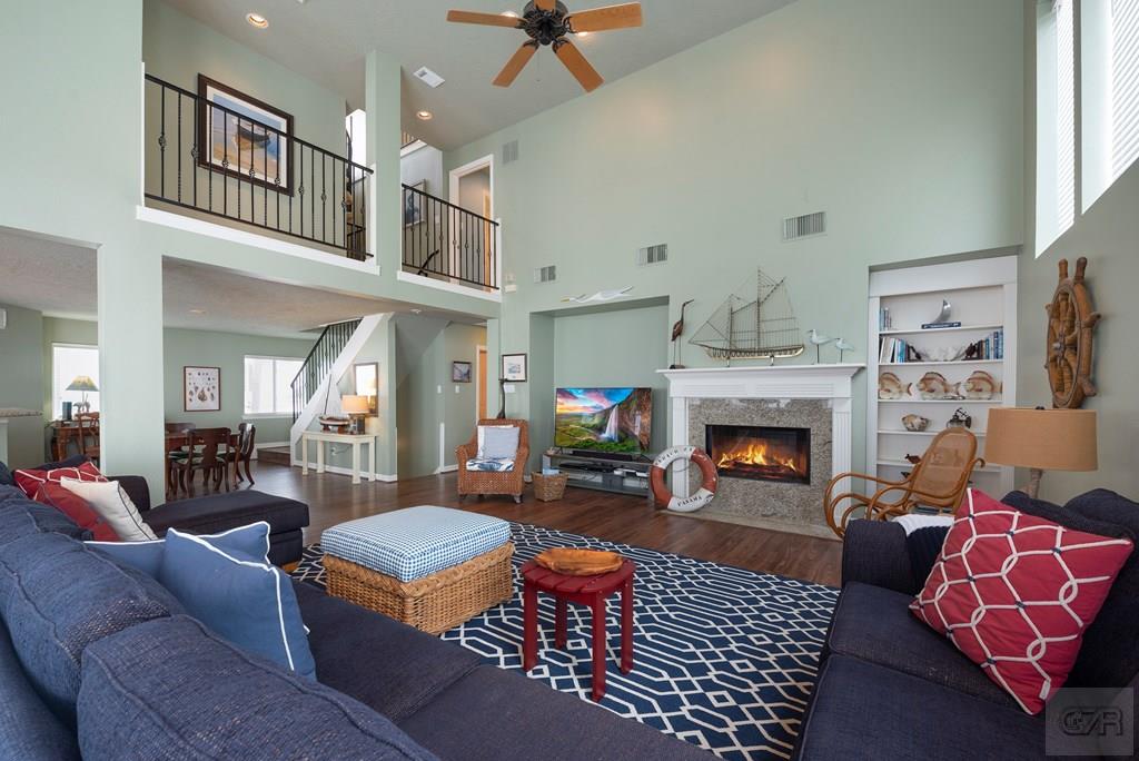131 Isles End Road Tiki Island, TX 77554 - Photo 10 of 48 a living room with furniture fireplace and rug