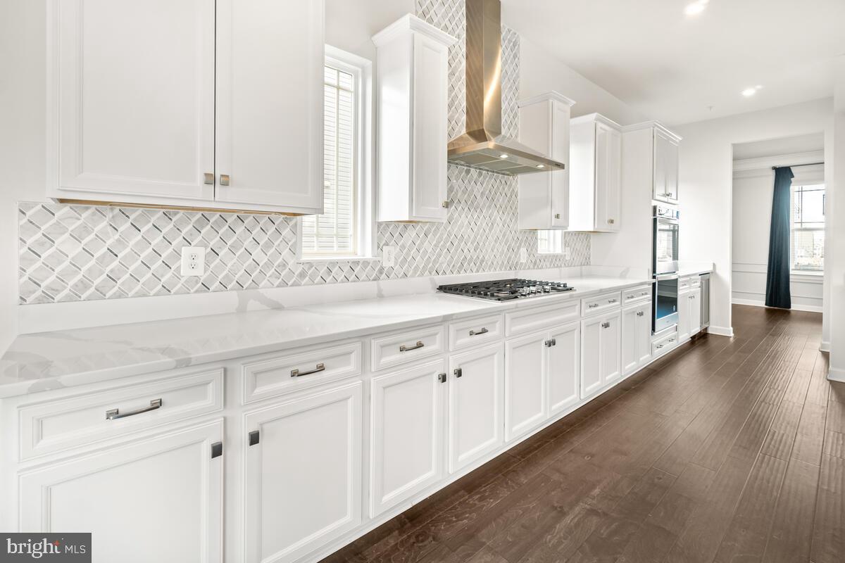 5521 Hawk Ridge Road Frederick, MD 21704 - Photo 15 of 66 a kitchen with granite countertop white cabinets and white appliances