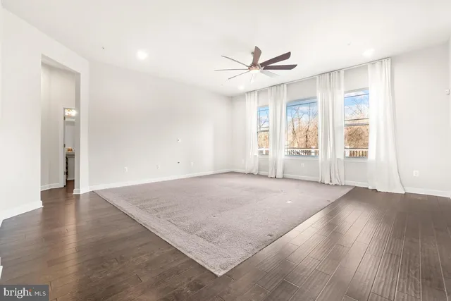 a bathroom with a sink mirror and toilet