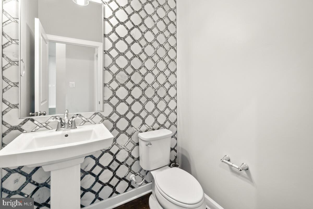 5521 Hawk Ridge Road Frederick, MD 21704 - Photo 21 of 66 a bathroom with a sink mirror and toilet