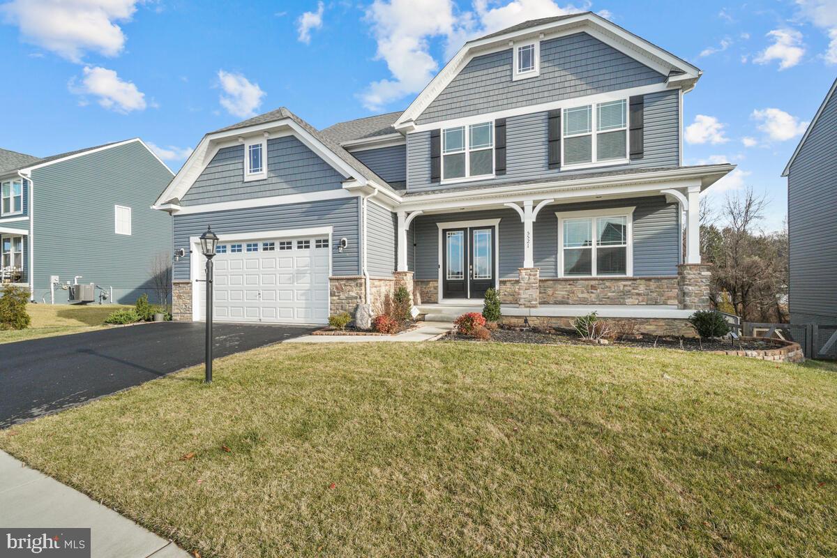 5521 Hawk Ridge Road Frederick, MD 21704 - Photo 3 of 66 a front view of a house with a yard