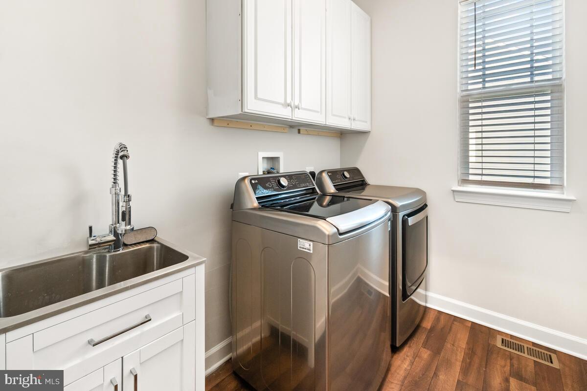 5521 Hawk Ridge Road Frederick, MD 21704 - Photo 32 of 66 a utility room with sink dryer and washer
