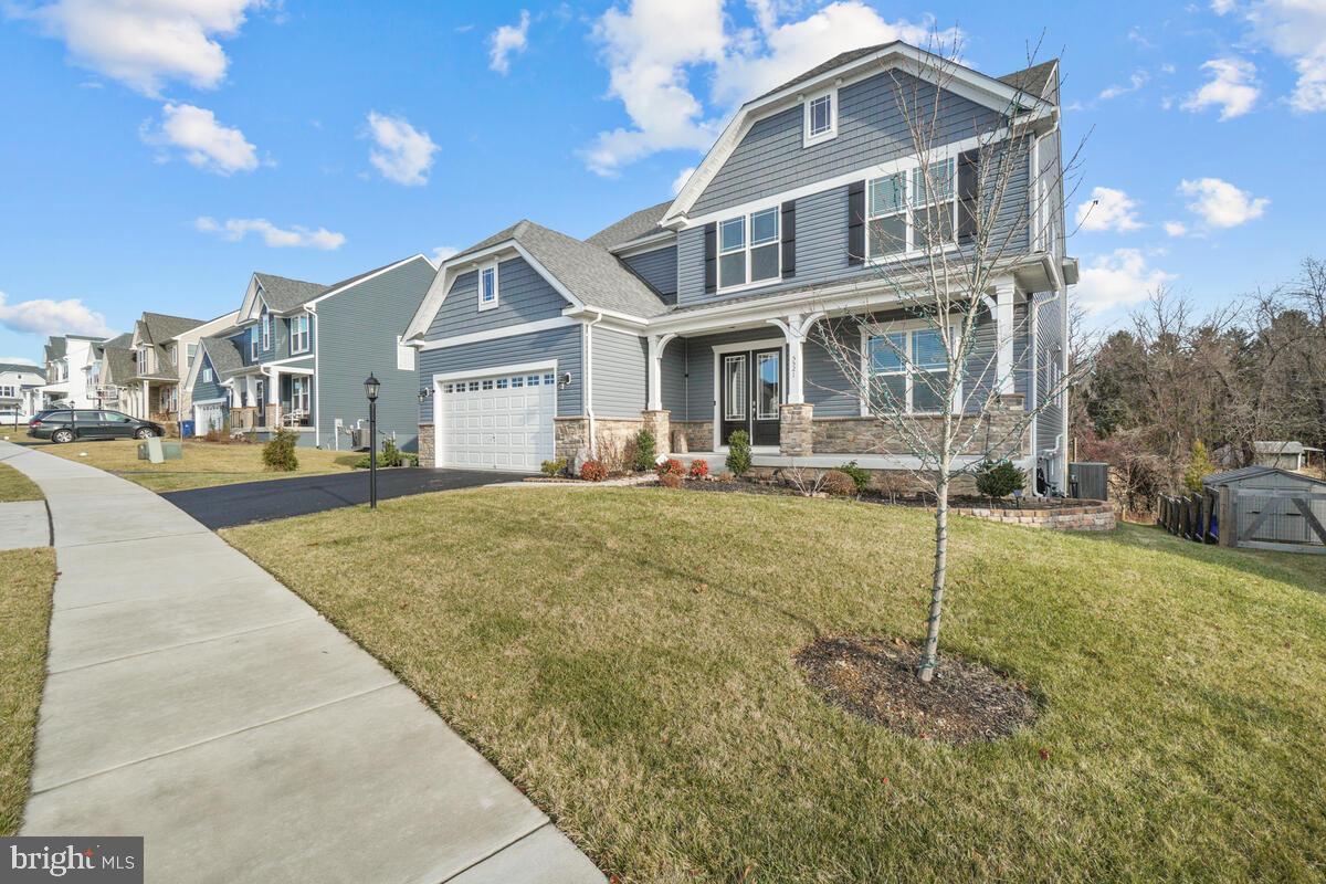 5521 Hawk Ridge Road Frederick, MD 21704 - Photo 4 of 66 a front view of a house with a yard