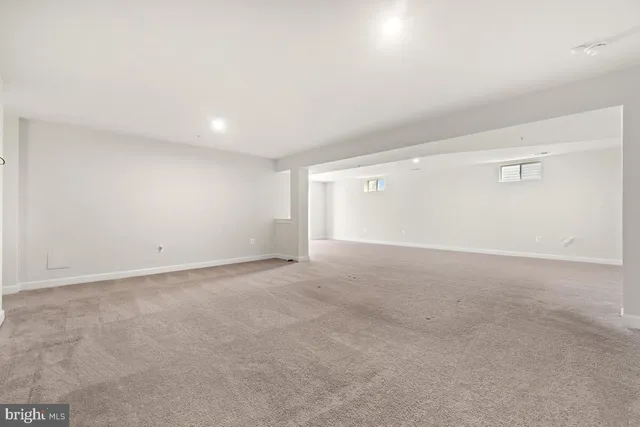 a view of a house with wooden fence