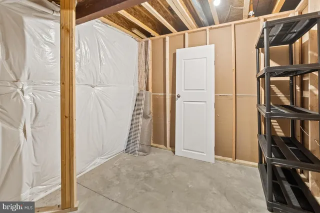 a view of house with a yard and potted plants