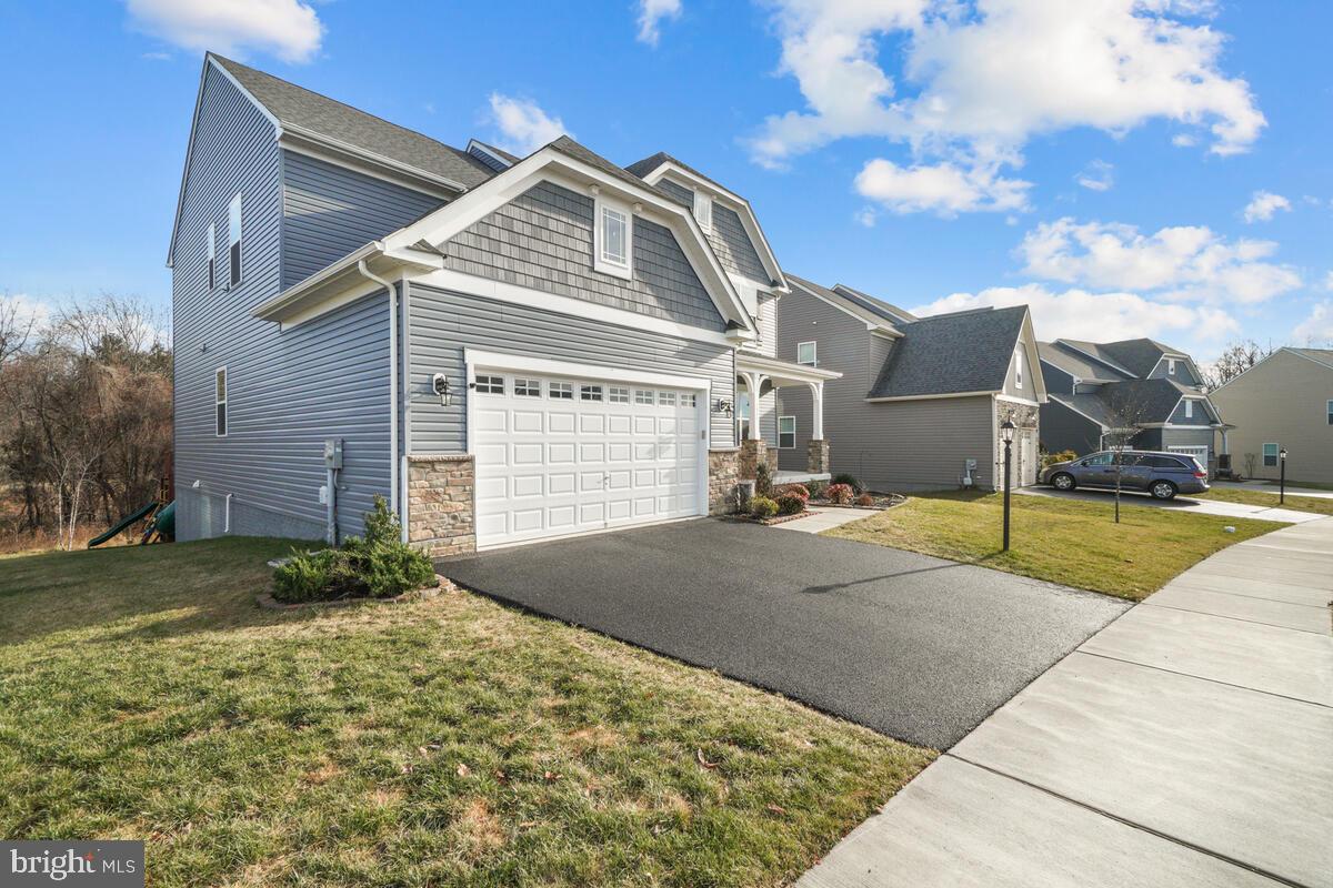5521 Hawk Ridge Road Frederick, MD 21704 - Photo 50 of 66 a front view of a house with a yard